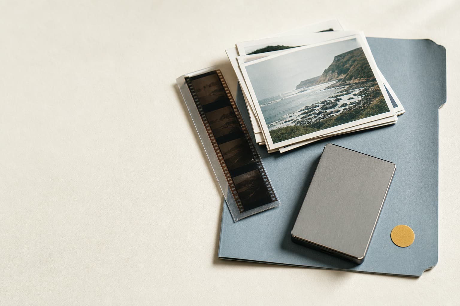Photographs, film, and a local drive arranged together inside a blue project folder